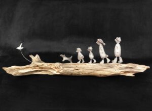 People on Driftwood - Family with Dog and Bird